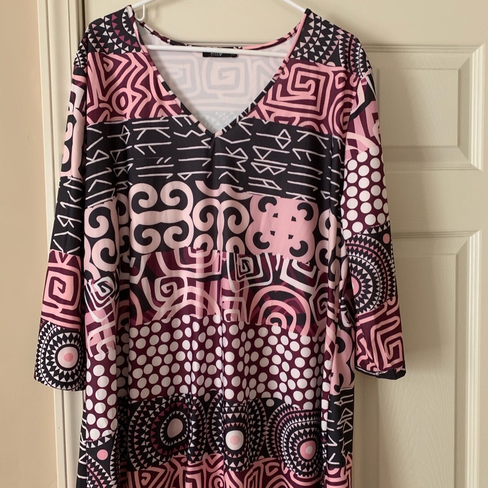 Shirt is made by Lily. Bought it from Zulily.